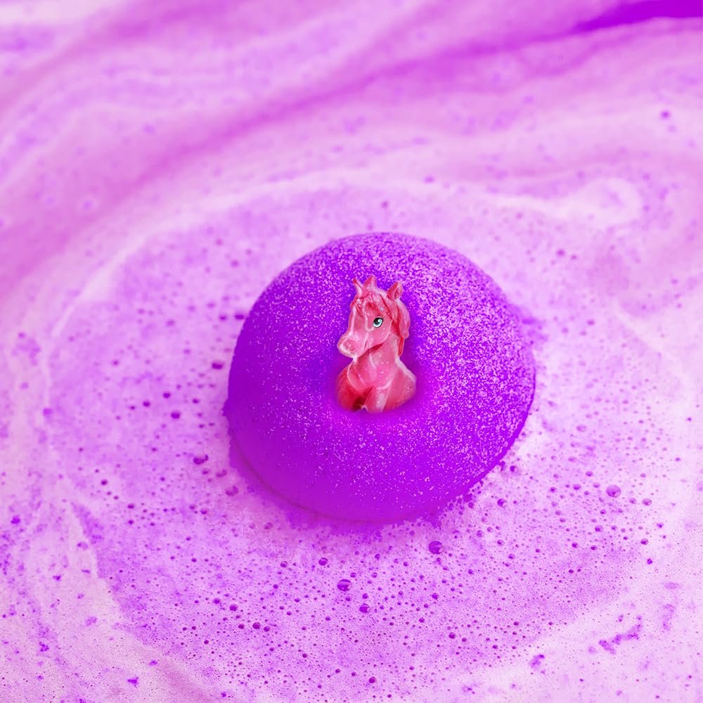 One hundred gram pink bath bomb being dropped into clean warm bathwater