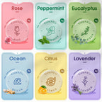 Six different varieties of CalmNFiz shower bath bombs arranged by color and scent.