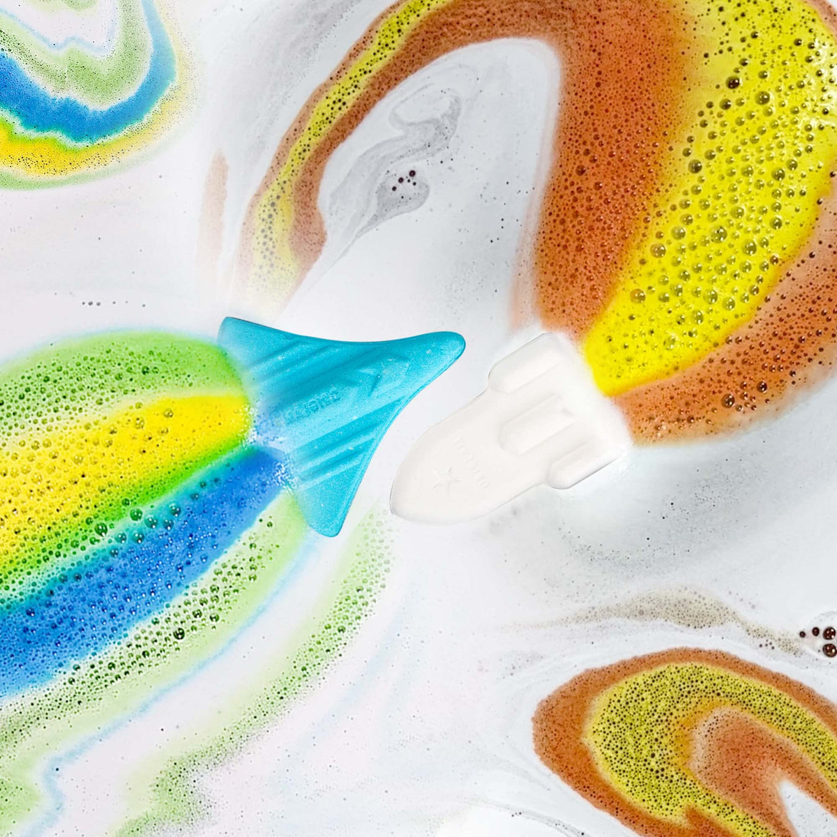 ORIGLAM kids bubble bath fizzers dissolving with rainbow color trails in water