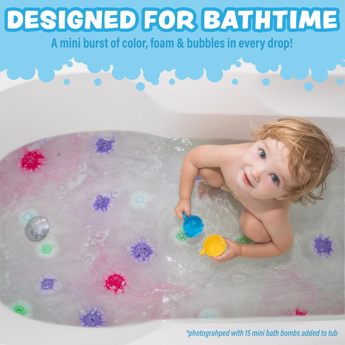 Tub Works Lil Bursts Mini Bath Bombs dissolving into colorful tub water