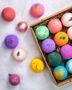 LifeAround2Angels moisturizing bath fizzies with premium ingredients arranged on a bathroom vanity