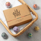 Top view of LifeAround2Angels bath fizzies showcasing distinct colors and dried flower petal details