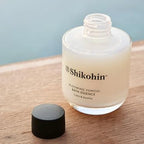 Back label of SHIKOHIN yomogi bath oil showing directions and key botanicals