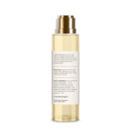 Forest Essentials Nargis bath oil bottle placed gracefully on a clean surface showcasing the elegant packaging design.