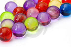 Assorted colorful retro bath pearls dissolving in warm water