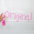 Child using Mr. Bubble foam soap to sculpt shapes in the bathtub