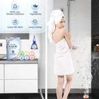 TranquilBliss aromatherapy steamer placed inside the mesh net bag attached to a bathroom tile wall.