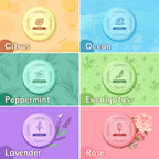 Six individual essential oil shower tablets unpacked showing different color variants