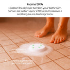 Rose aromatherapy shower steamer placed on bathroom tiles getting activated by water steam.