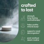 A continuous stream of warm water activating a wellness shower tablet on the floor to release aromatic vapors.