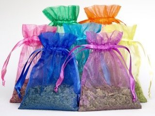 Seven large refillable neem bath tea bags in silver packaging