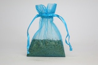 Detailed view of natural dried neem leaves inside muslin bag