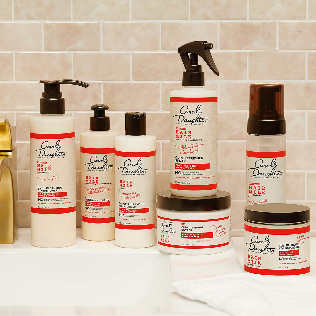 Ten fluid ounce bottle packaging of imported Carol's Daughter curly hair product