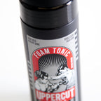 Authentic Uppercut Deluxe low shine light hold hair tonic bottle standing upright