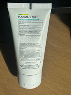 Travel-sized SweatBlock clinical strength lotion in hand