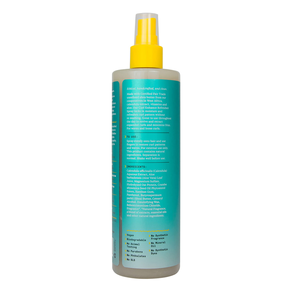 Alaffia wavy to curly hair refresher spray bottle standing upright on a clean retail display surface.
