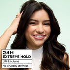 Three cans of Garnier Sky-Hi Volume hair mousse showing imported packaging close up