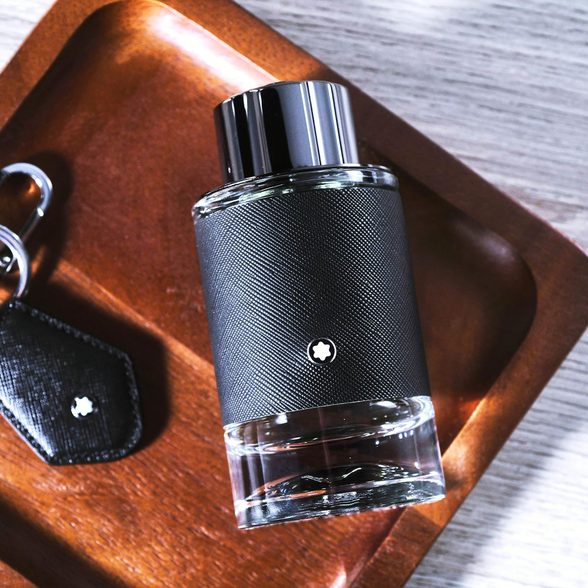 Imported Montblanc Explorer luxury aftershave balm for men isolated on a clean background.