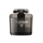 Skull Shaver cleaning solution stand holding an electric rotary shaver upright on a modern bathroom counter.