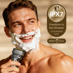 Waterproof electric razor being rinsed under water