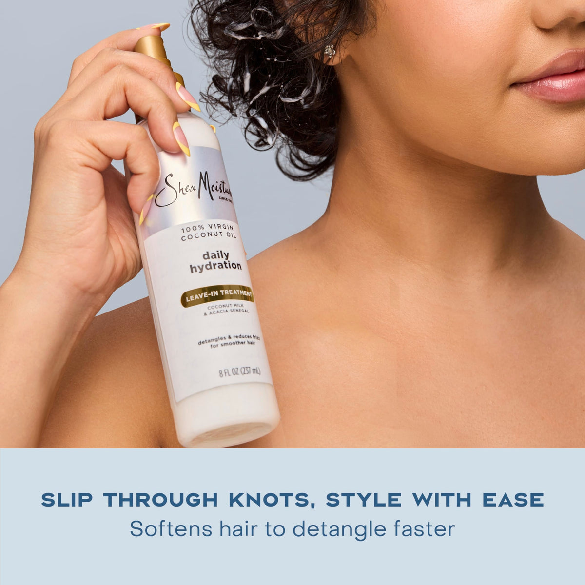 Texture shot of the lightweight milky fluid from the Shea Moisture coconut hair treatment.