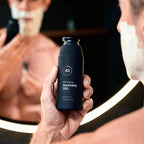 Side view of Particle 4.05 fluid ounce shaving gel packaging