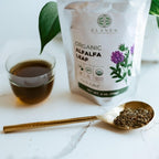 Loose leaf alfalfa herb inside a glass cup for brewing