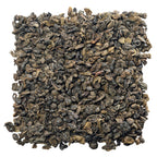 Close up of U.S. Wellness Naturals loose leaf gunpowder green tea pellets