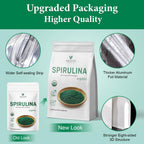 Green spirulina algae powder being scooped with the included measuring spoon