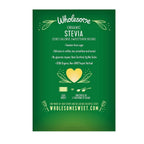 Wholesome plant based sugar substitute packets displayed on a kitchen counter next to a hot cup of coffee.