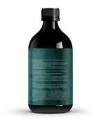 UN·SUL·LIED stinging nettle oil texture being applied to fingertips for hair care