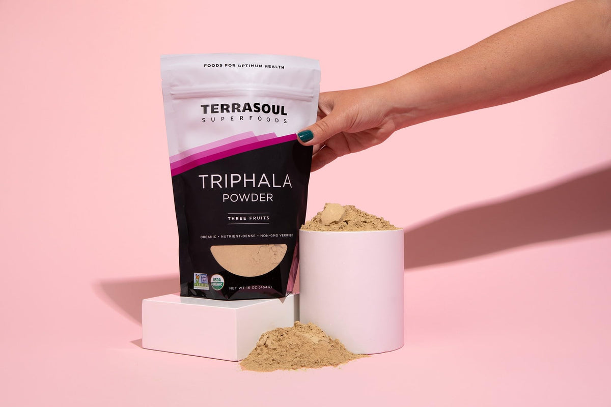 Terrasoul Superfoods Organic Triphala digestive tonic fine powder texture displaying its natural herbal color.