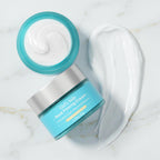 Close up of product container highlighting the caffeine and hyaluronic acid ingredient blend.