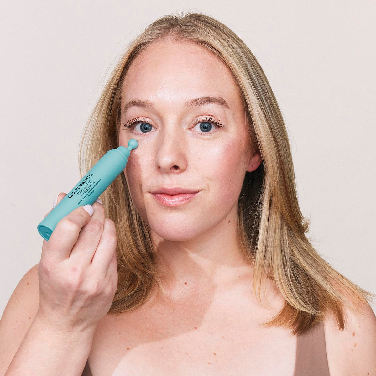 Lightweight gel eye serum texture from Eight Saints being applied to skin.