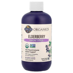 Garden of Life Sambucus elderberry immune syrup bottle with the included serving cup visible.