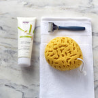 Back label of NOW Foods Nutri-Shave Cream showing USA import details and full ingredient list