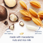 Hand applying Dove body scrub for exfoliation