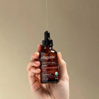 Premium cruelty free botanical oil targets dryness on face hair and cuticles