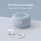 Buffbee compact white noise alarm clock being packed into travel luggage for a trip.