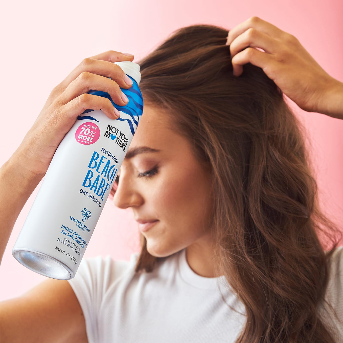 Two cans of Not Your Mother's Beach Babe dry shampoo with toasted coconut label