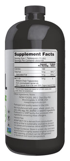 NOW Foods Medium Chain Triglycerides liquid supplement bottle back label displaying nutritional facts and serving directions.