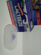 Lacteeze lactose intolerance supplement bottle standing next to the included compact plastic travel pill storage case.