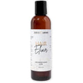 BASK & LATHER Elixir Hair Strengthening Oil front view bottle for length retention